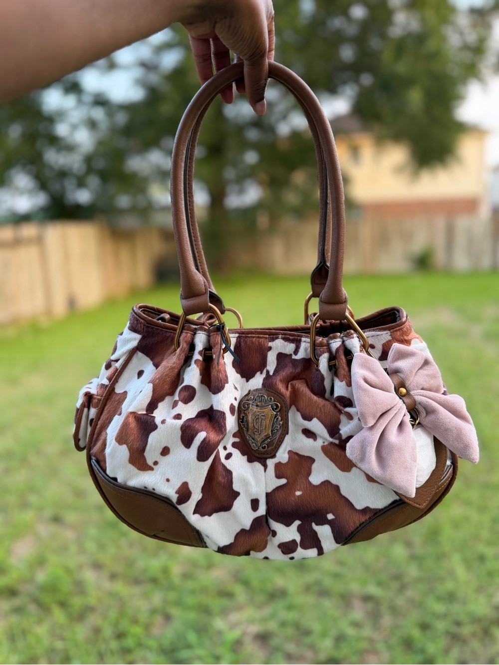 Juicy Couture Brown and White Cow Print Shoulder Bag with Pink Bow Accent